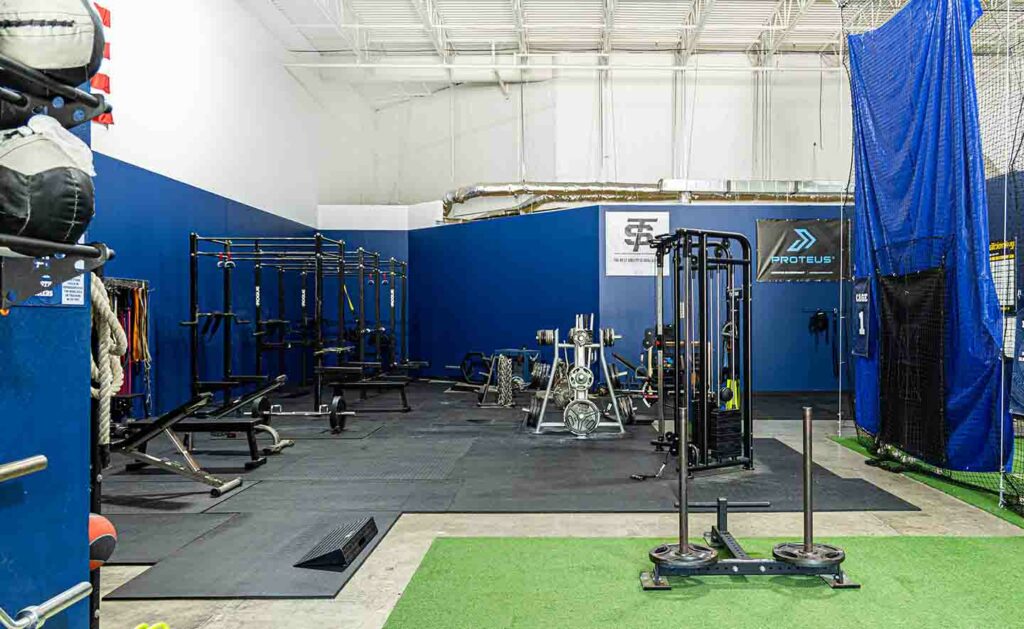 gym with weight lifting and fitness equipment